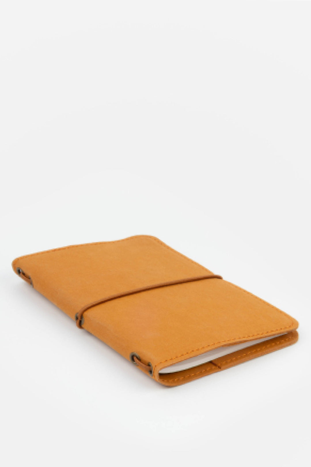 orange passport size sketch journal on a white background