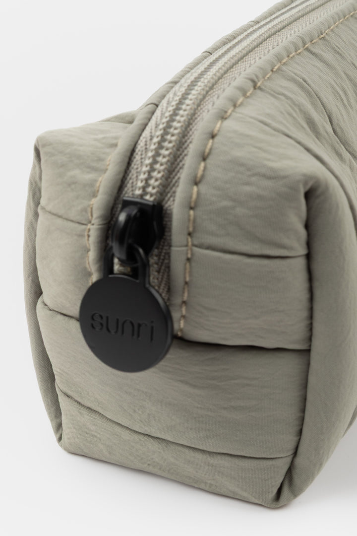grey pencil case with a zipper and 'sunri' brand tag on a white background