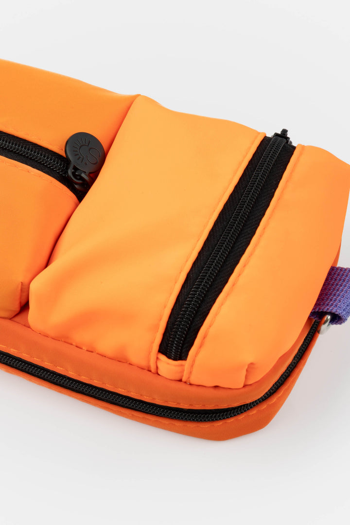 Close-up of the upper padded zipped compartment and zipper pull of the utility pencil case
