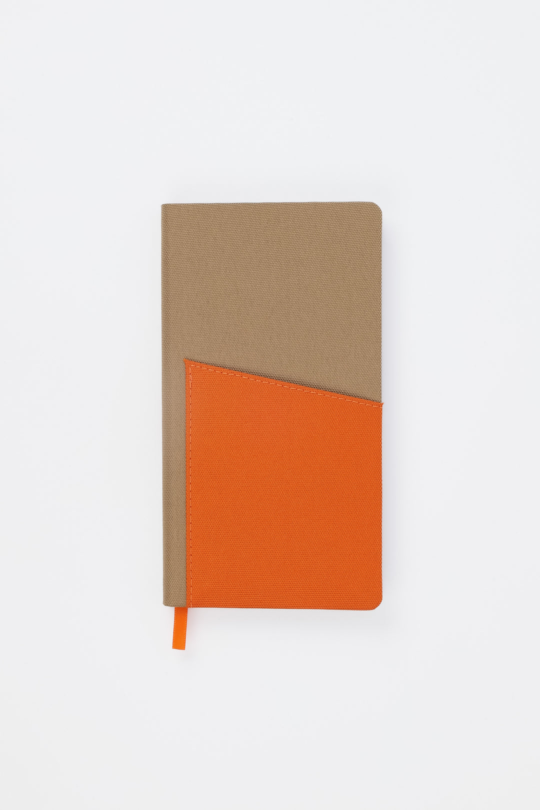 Front view of closed brown pocket notebook with orange fabric pocket
