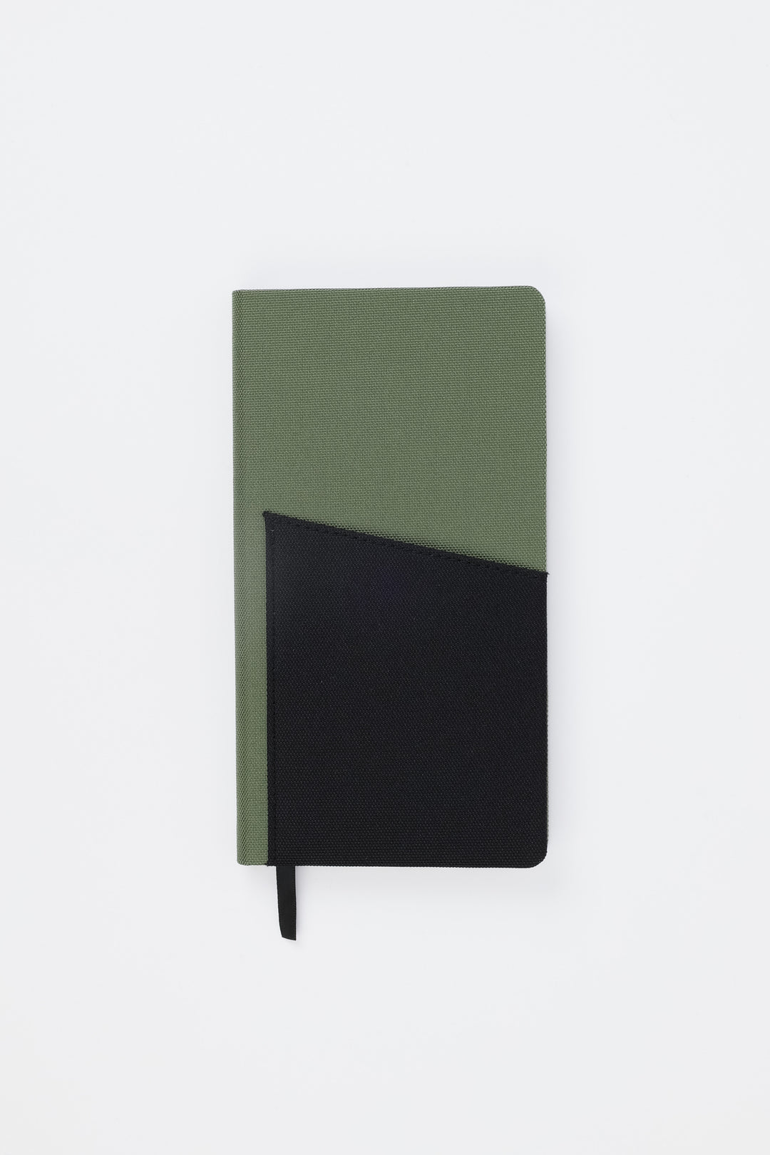 Front view of closed green pocket notebook with black fabric pocket
