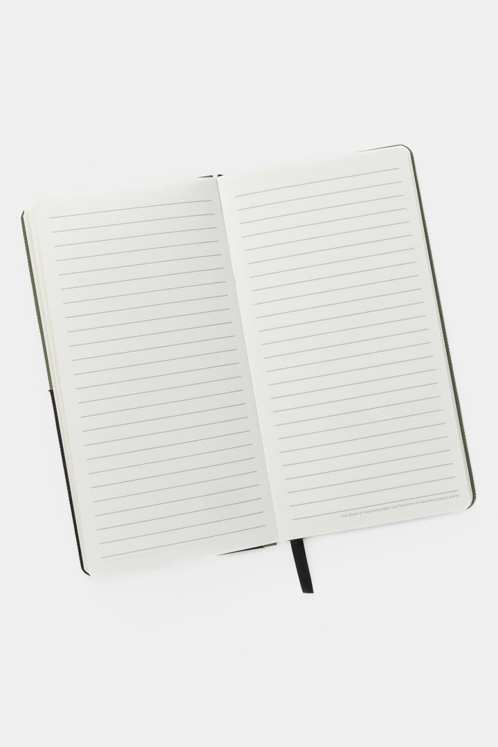 Open pocket notebook showing ruled pages and black ribbon marker
