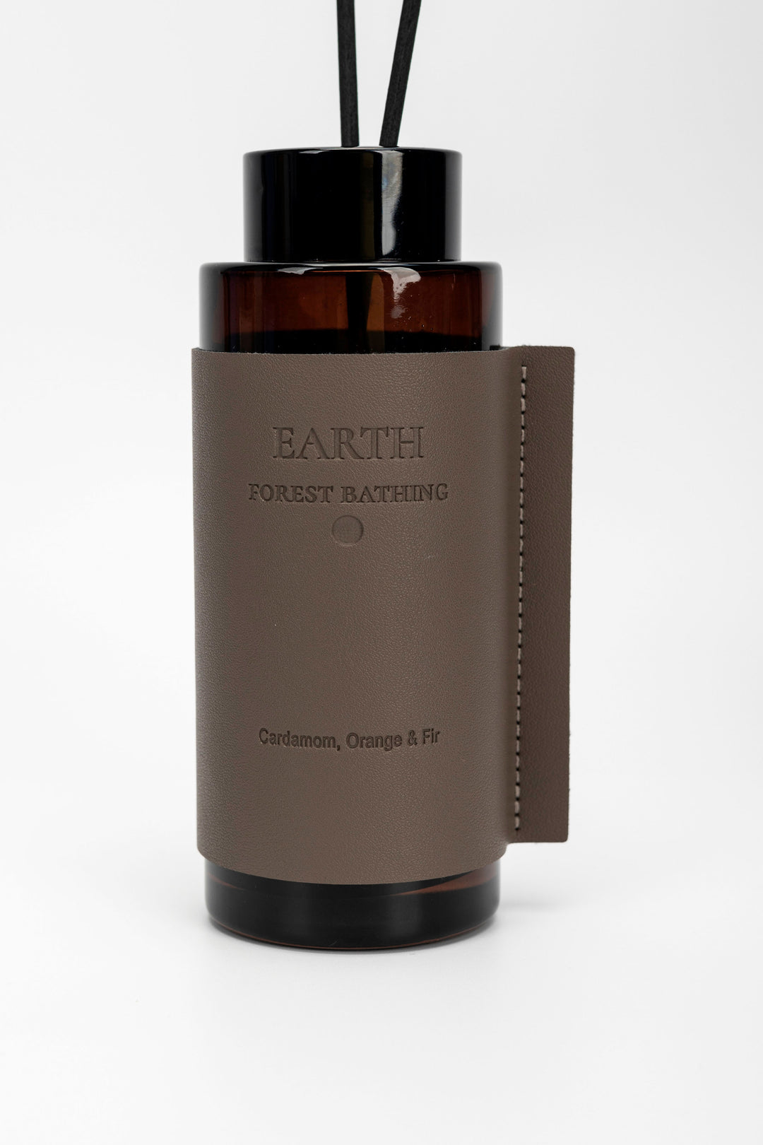 Brown diffuser bottle with Earth Forest Bathing label.