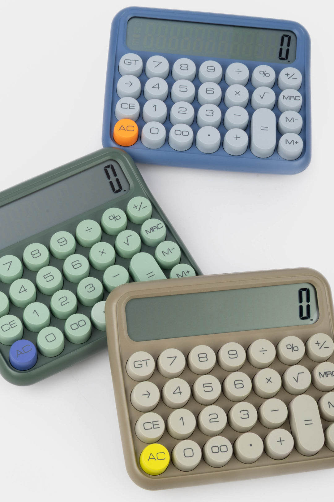Three calculators in different colors on a white background