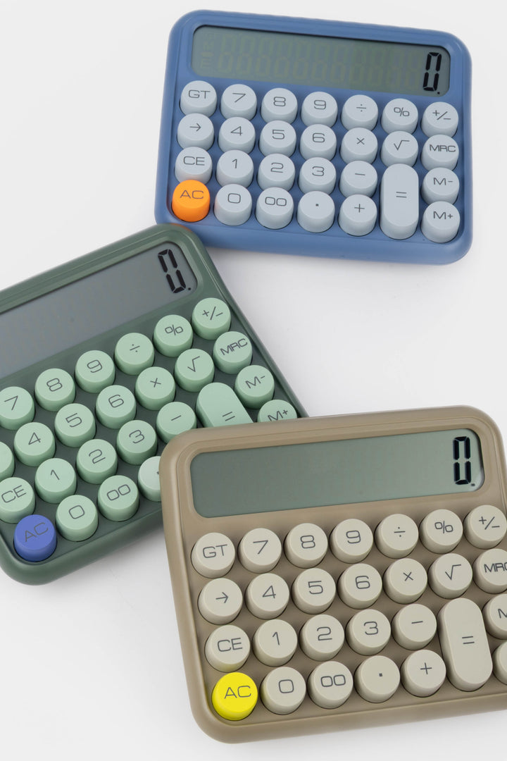 Three calculators in different colors on a white background
