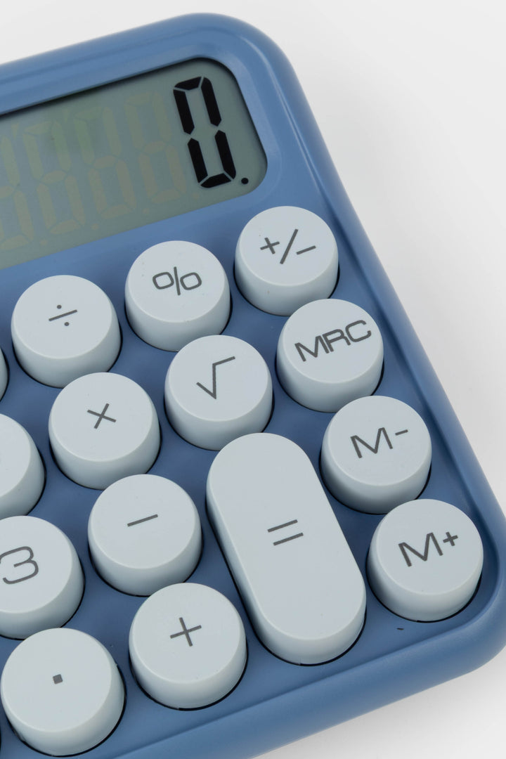 Close-up of a blue calculator with white buttons on a white background