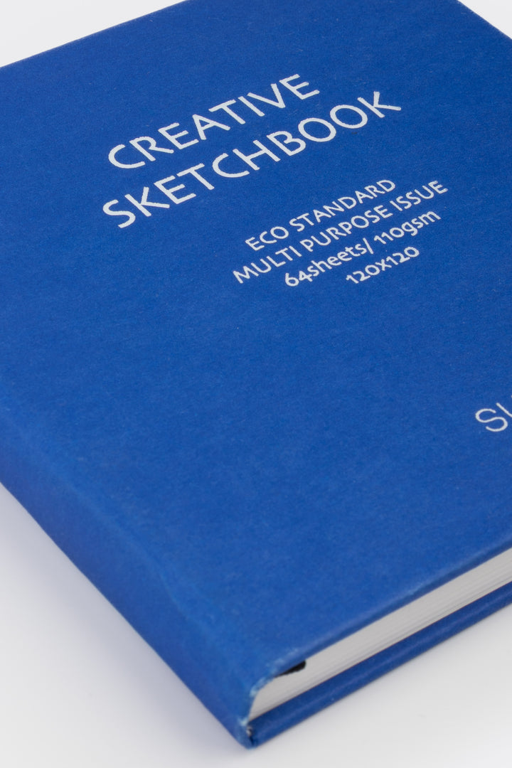 Blue sketchbook with white text on a white background