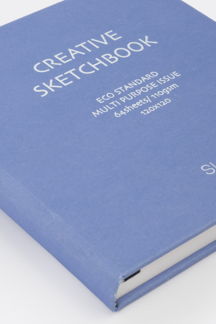 purple sketchbook with white text