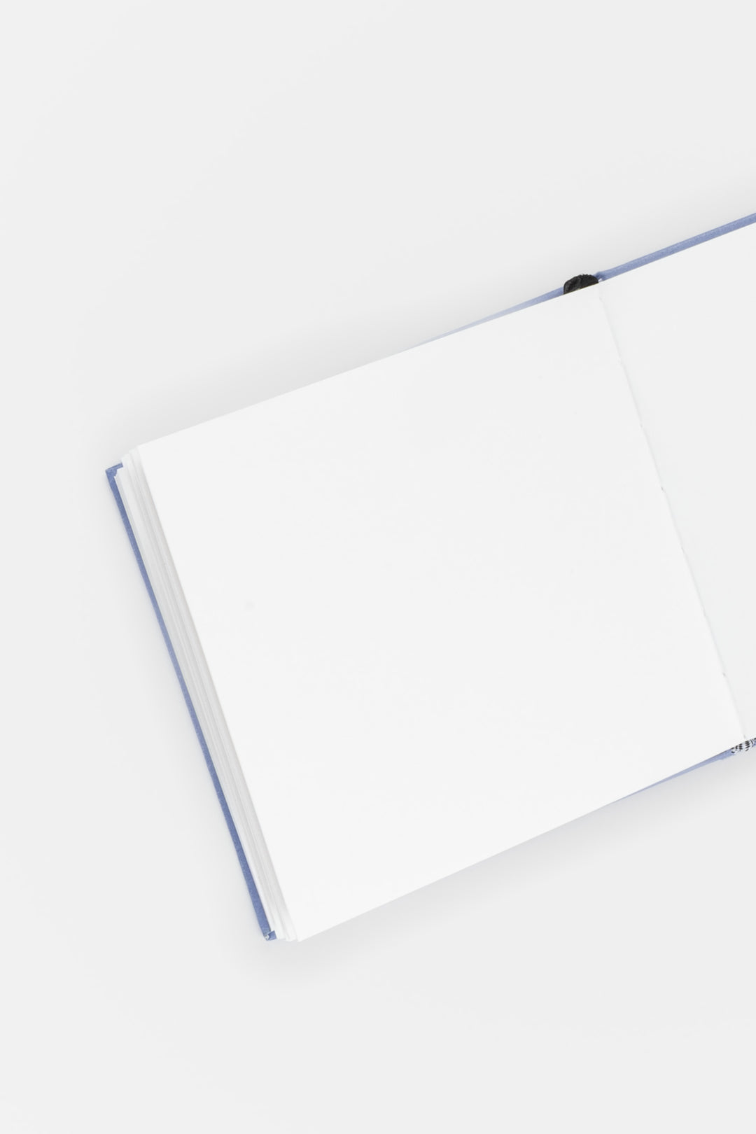 opened sketchbook with purple binding