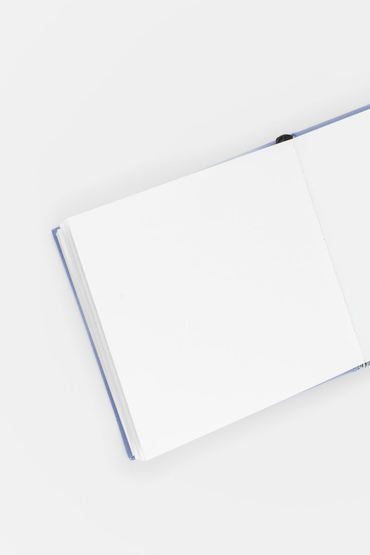 opened sketchbook with purple binding