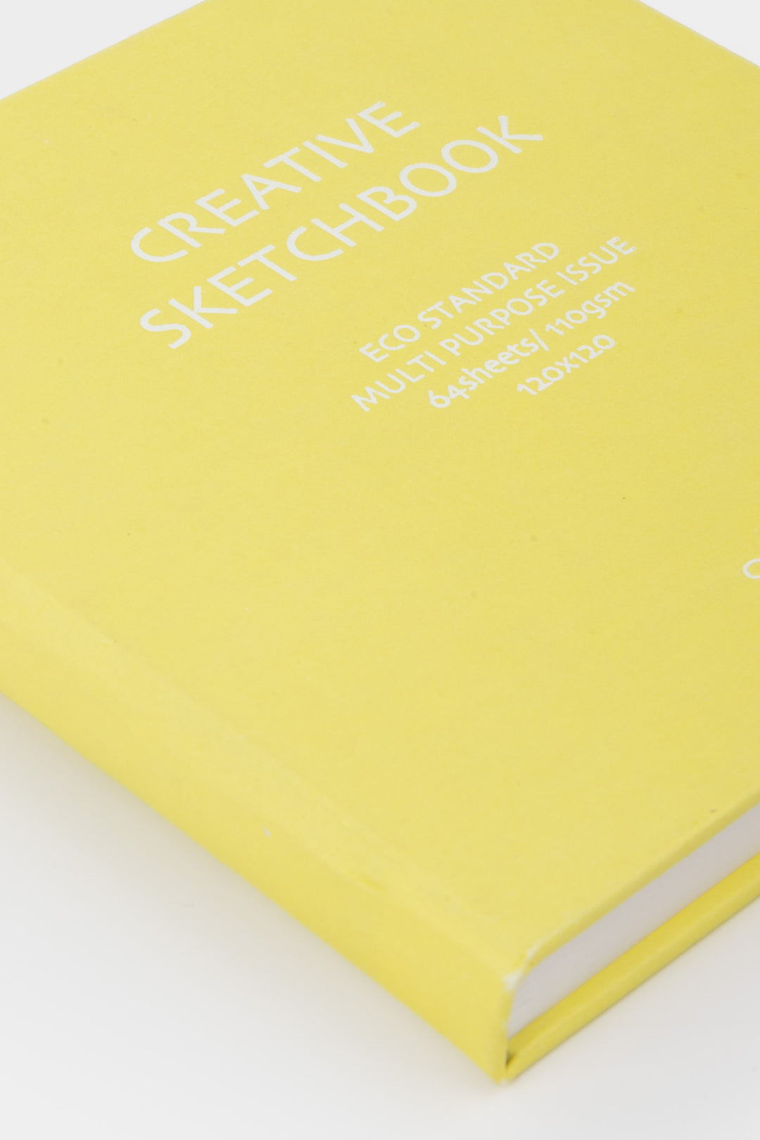yellow cover of sketchbook with white text