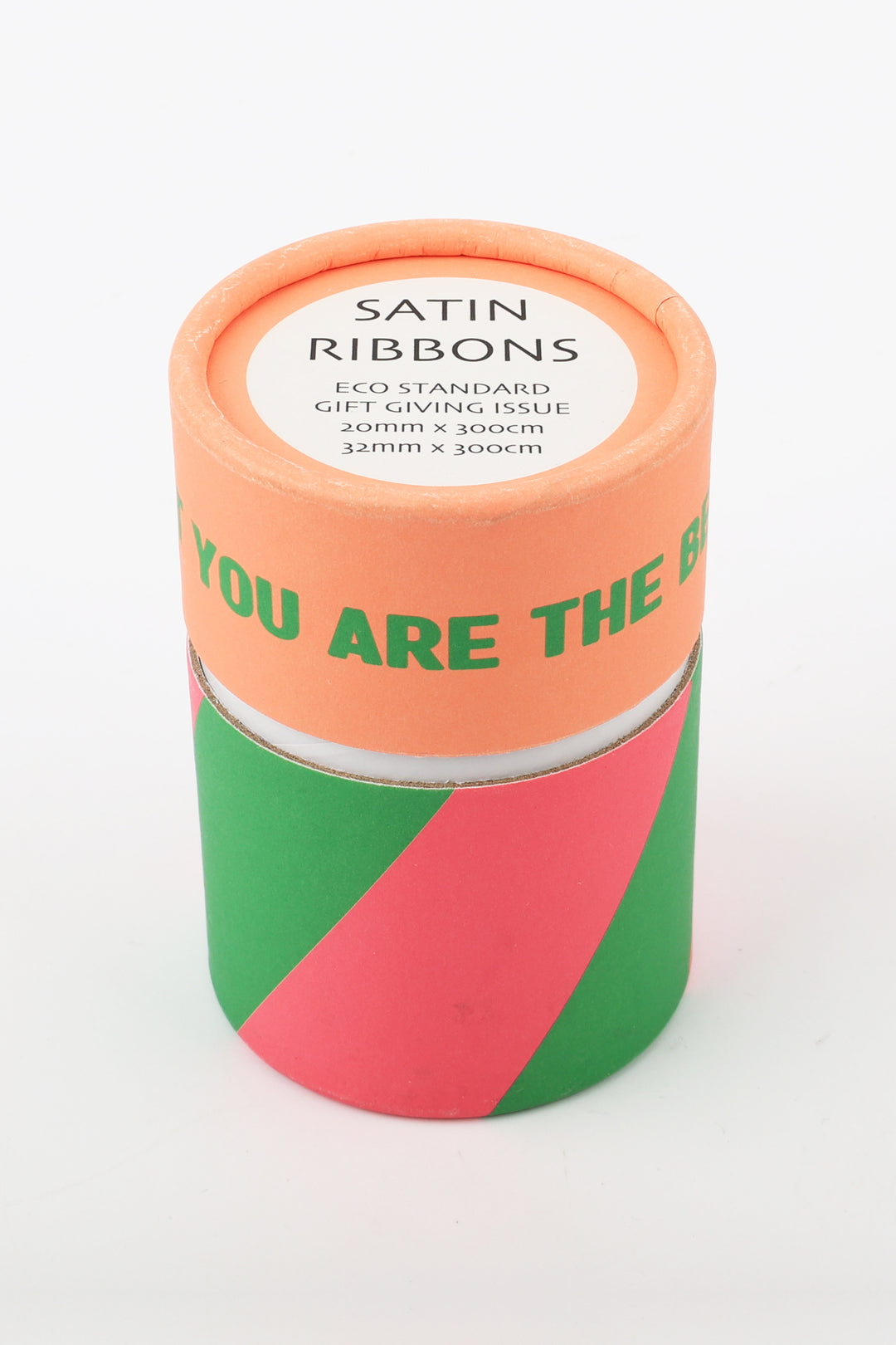 cylindrical printed paper can containing two satin ribbons size label visible on top pastel geometric print around base
