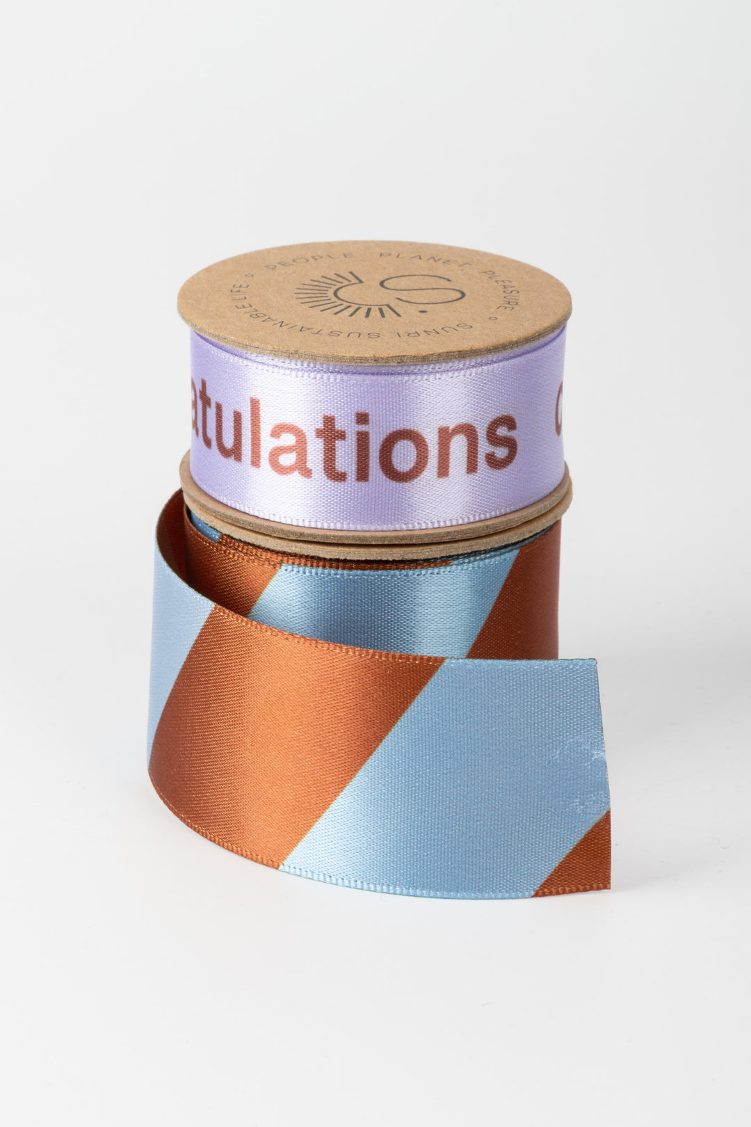 Roll of ribbon with 'Congratulations' text on a white background