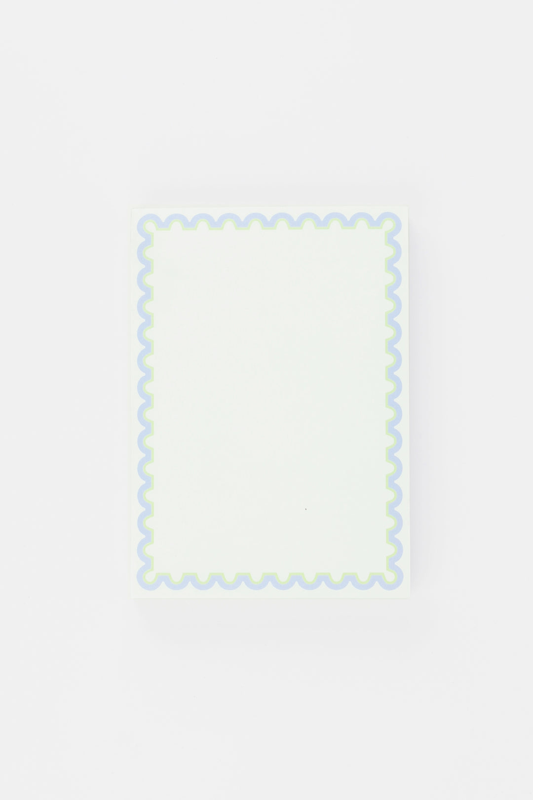 notepad with decorative border with wavy edge on a light gray background