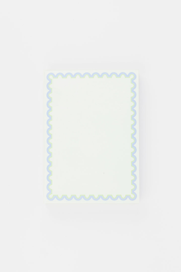 notepad with decorative border with wavy edge on a light gray background