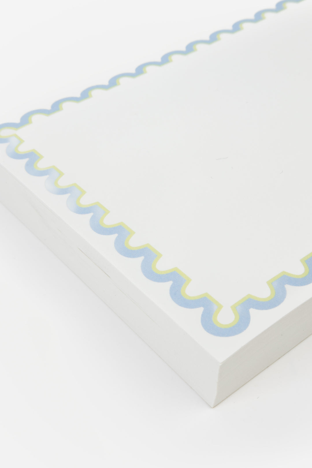 detail of notepad with decorative blue rim 