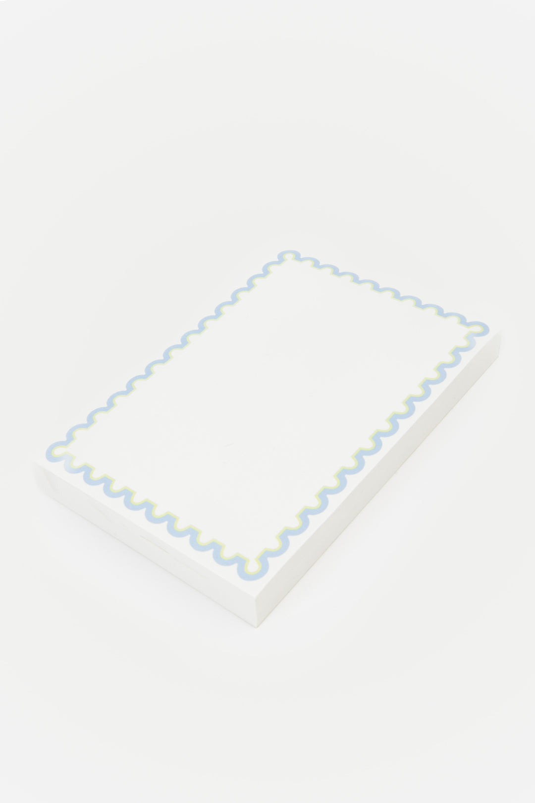 notepad with decorative blue rim 