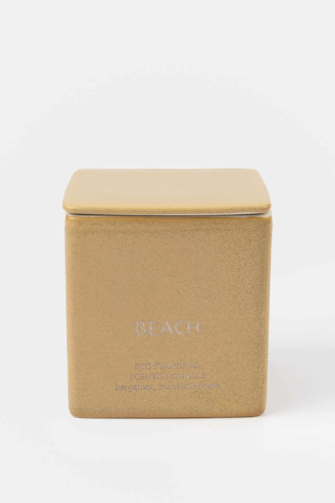 square brown ceramic candle with fitted lid, front view
