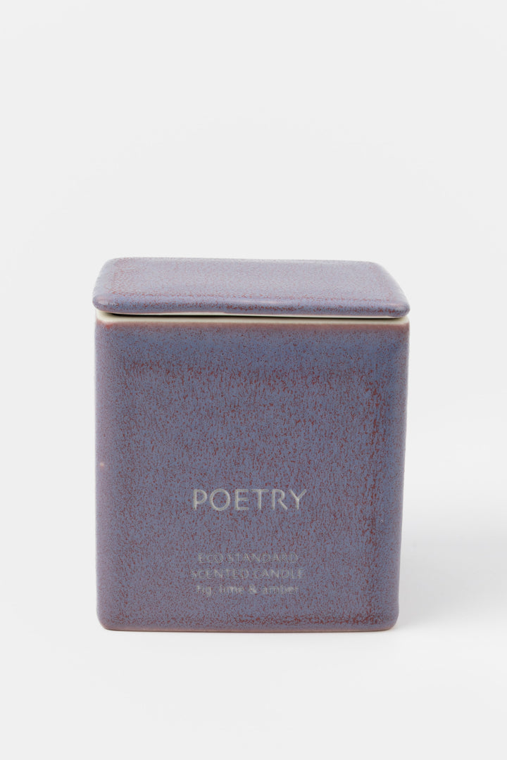 square purple ceramic candle with fitted lid, front view
