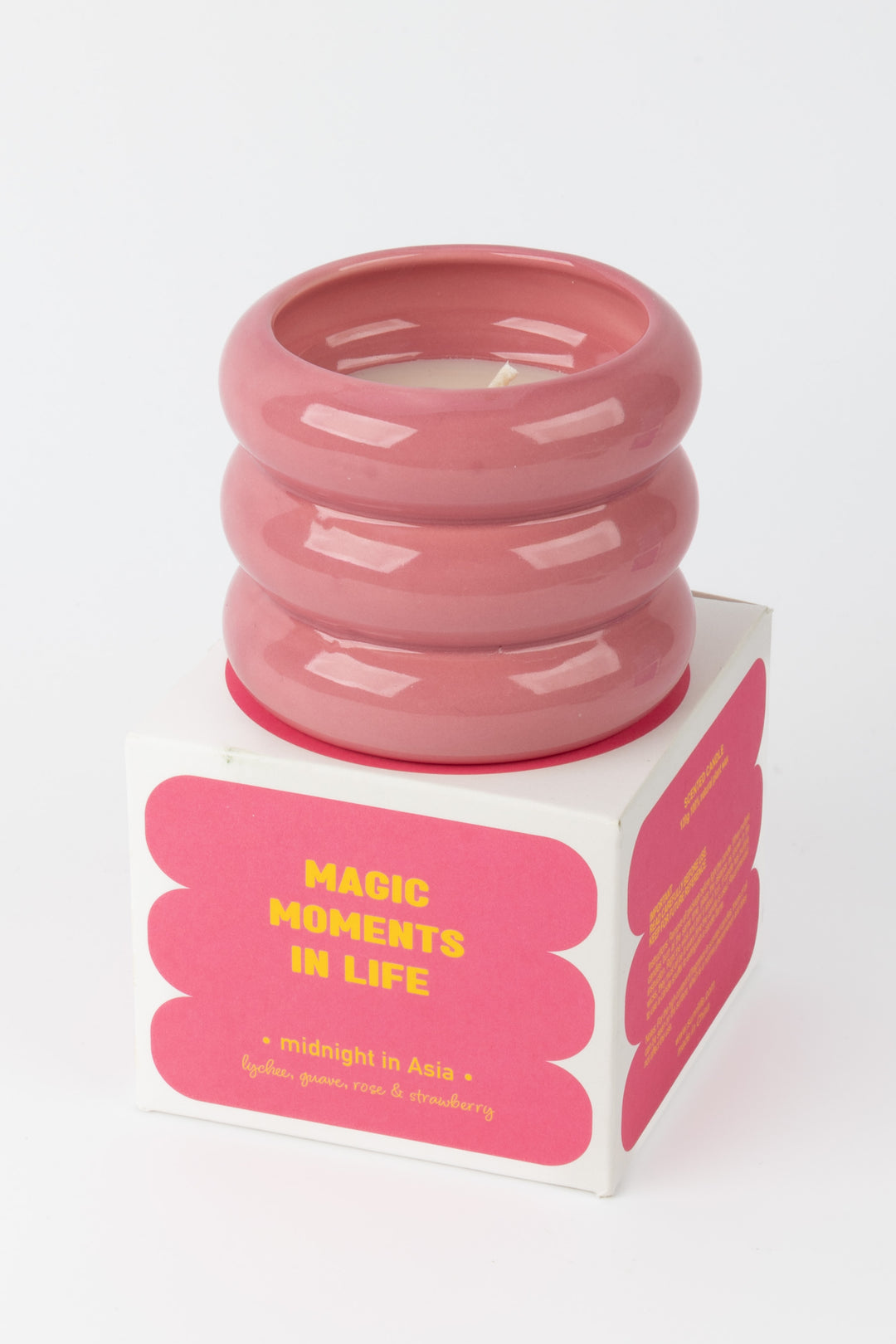 pink ceramic candle placed on matching midnight in asia packaging box
