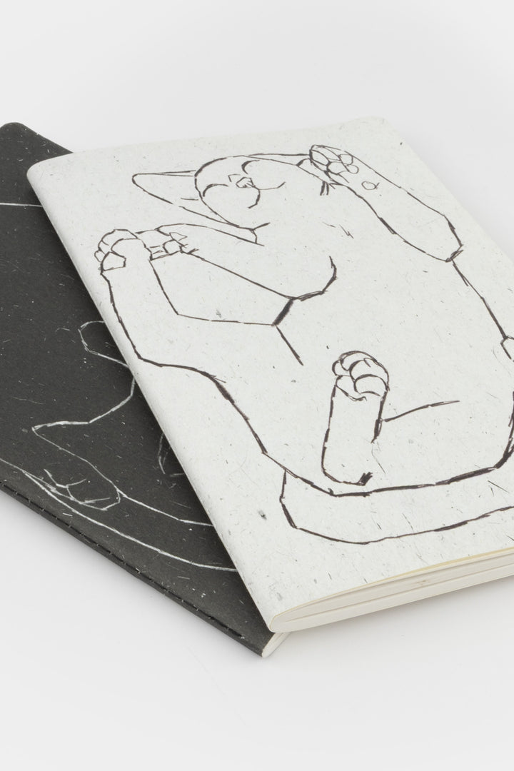 2 notebooks with  black and white illustration of cats 