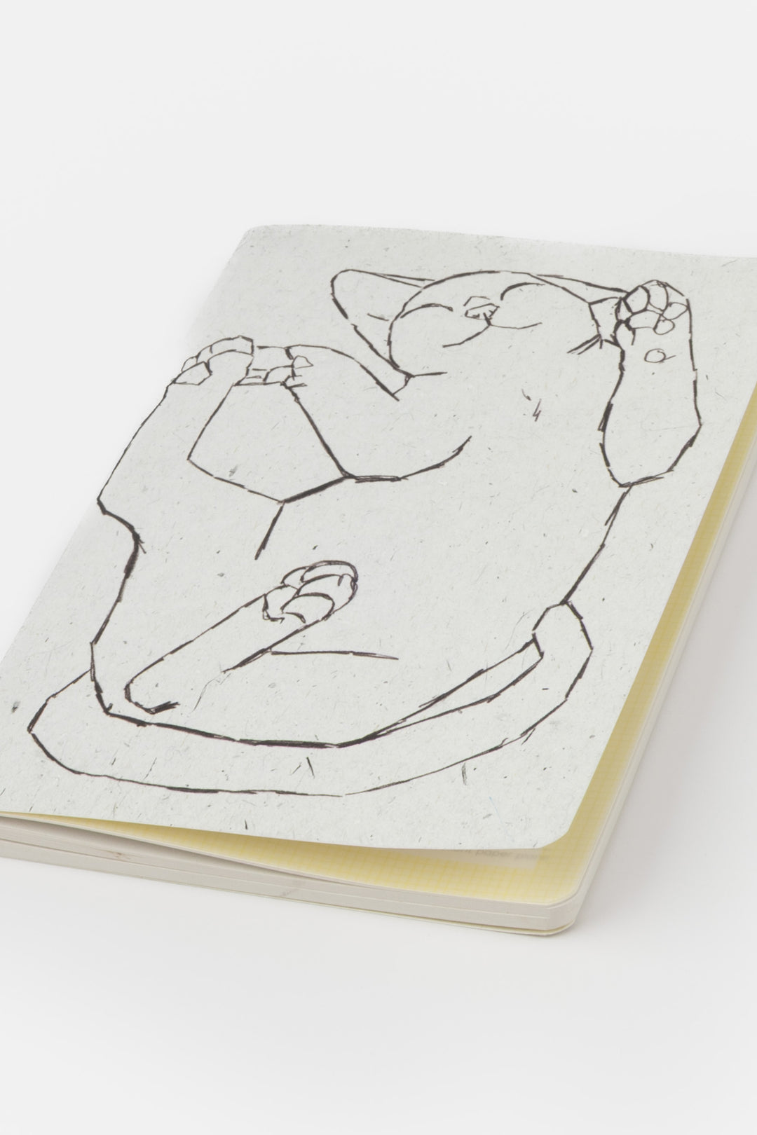 Notebook with a black line drawing of a cat on a white background