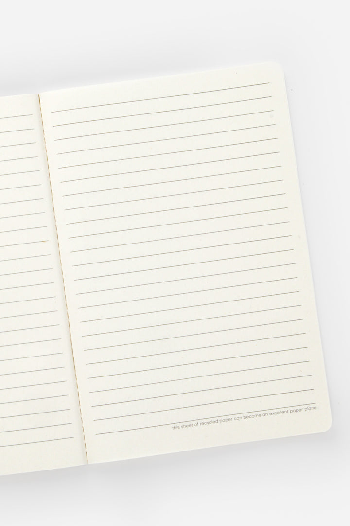 Open notebook with lined pages on a white background