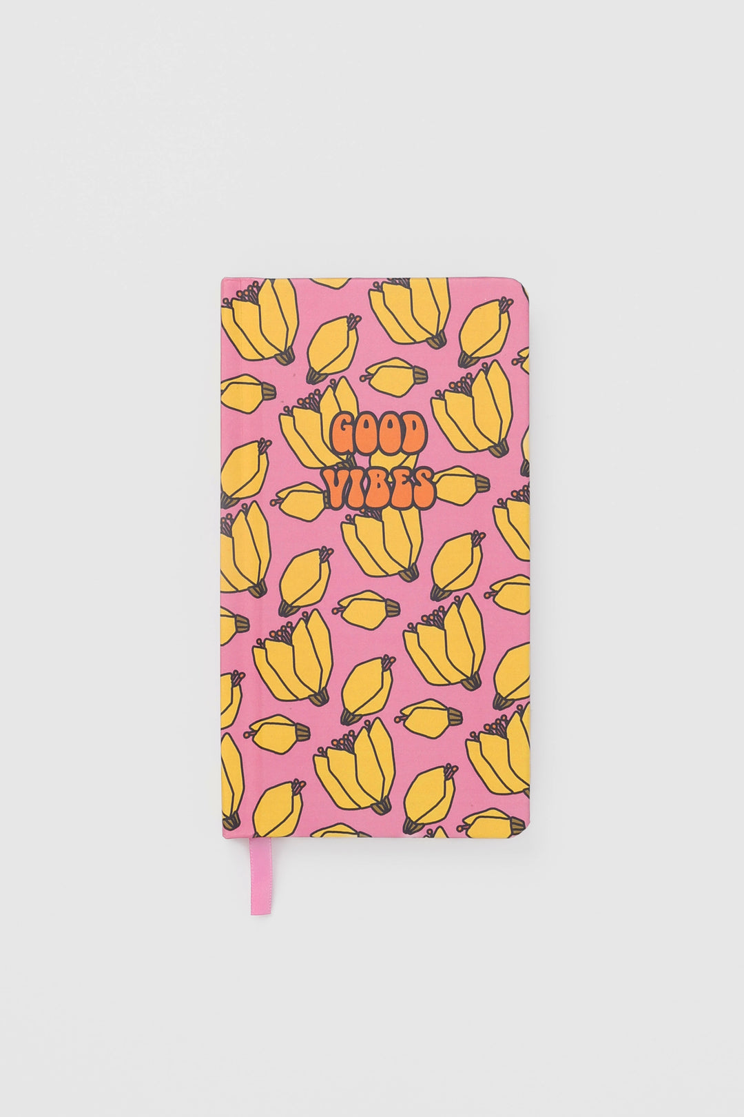 front view of a journal with a fruit pattern and a matching ribbon marker
