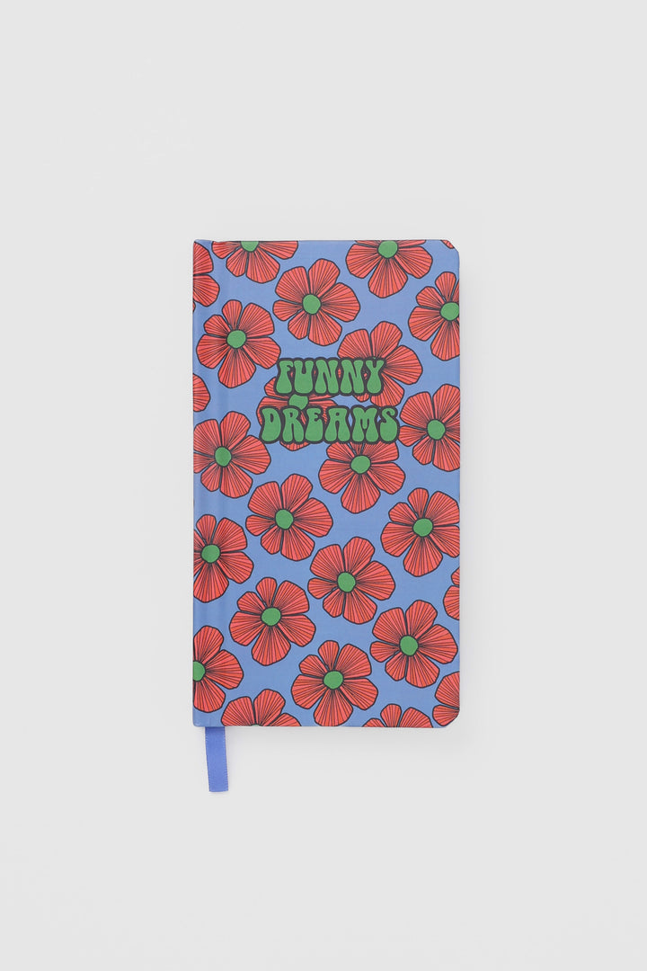 front view of a journal with a bold flower pattern and a matching ribbon marker
