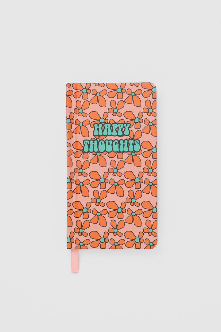 front view of a journal with a retro flower pattern and a matching ribbon marker
