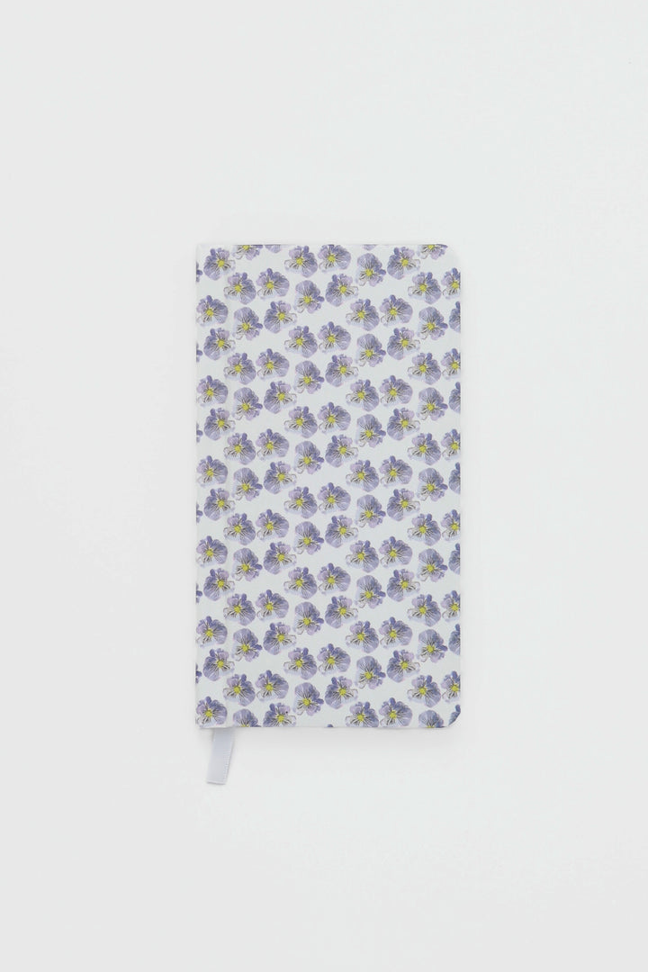 Notebook with floral pattern on a white background