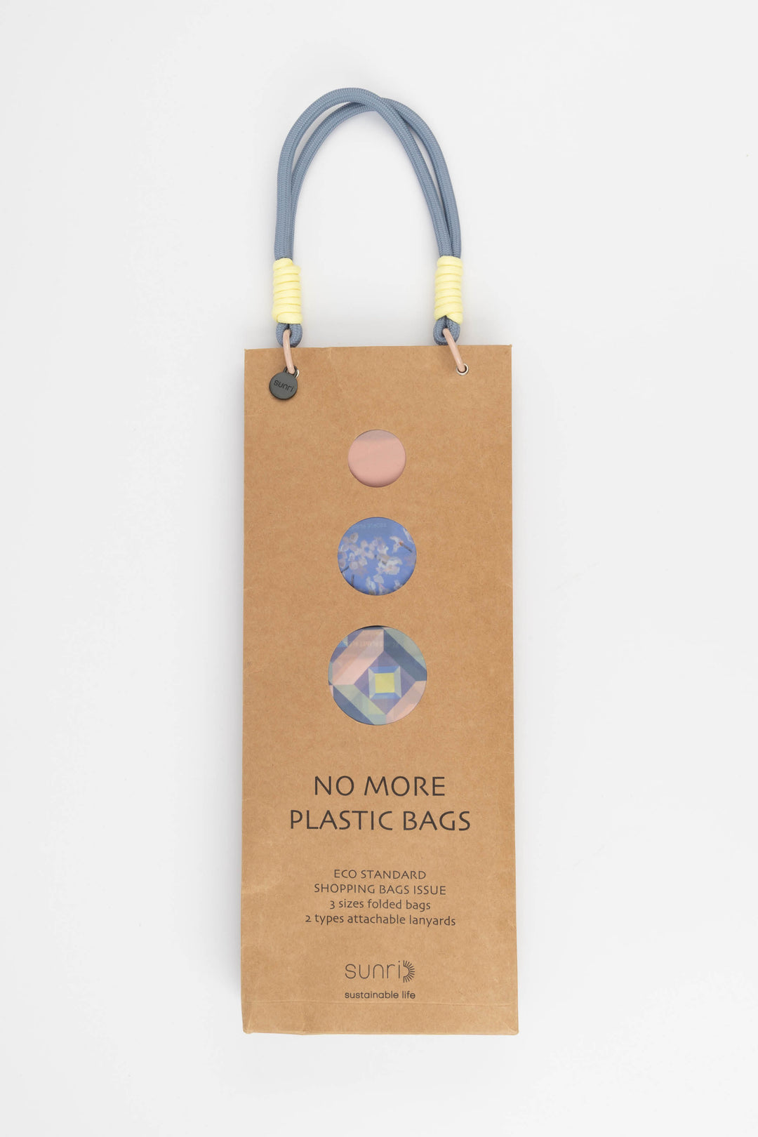 Cardboard packaging for shopping bags with colourful handles and visible branding 