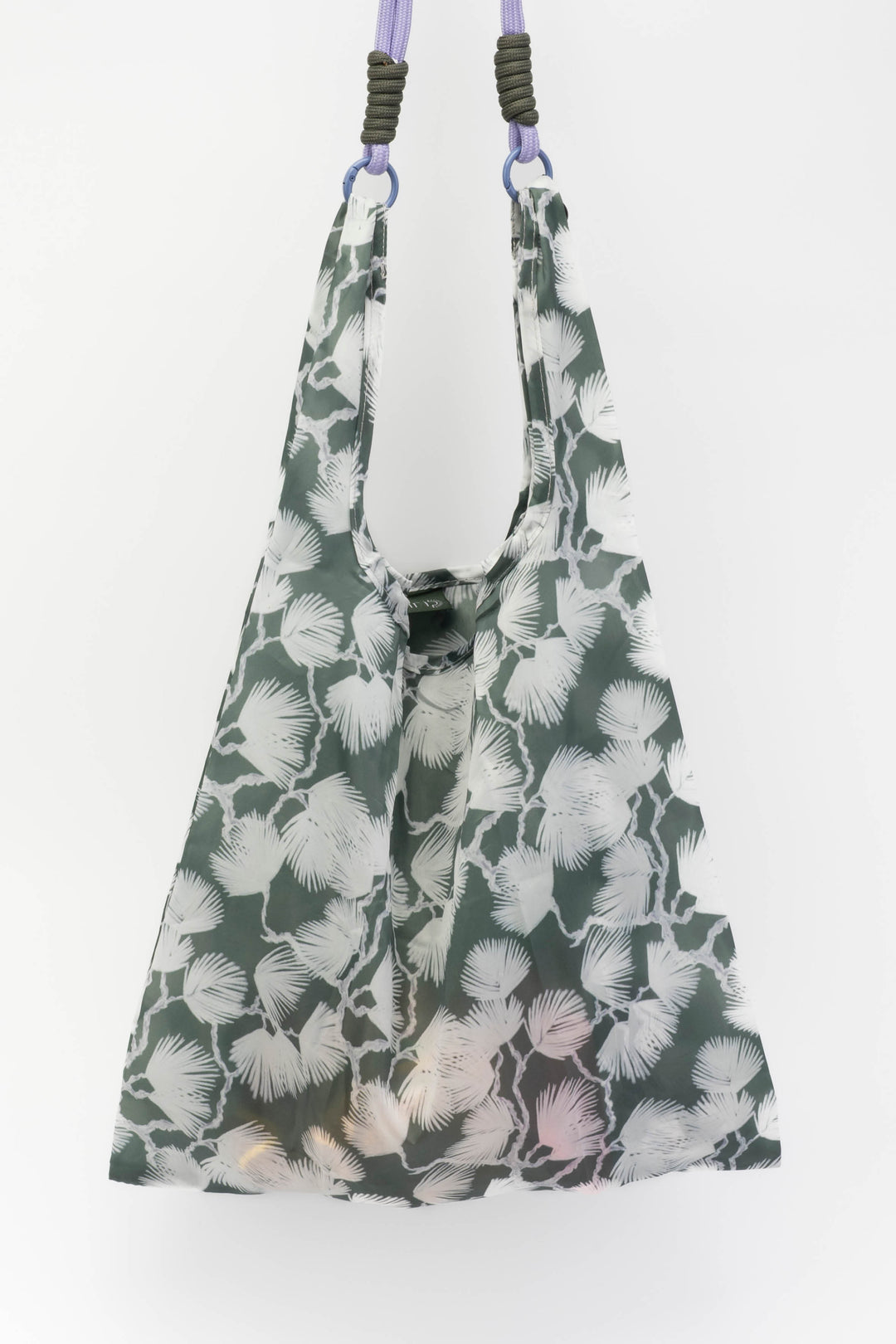 Floral patterned bag with straps on a white background