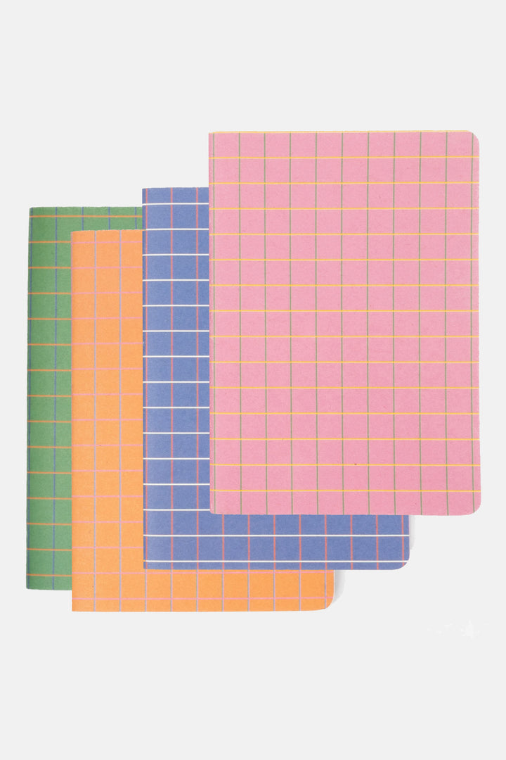 set of four mini notebooks in pink, blue, orange and green with contrasting grid covers layered flat
