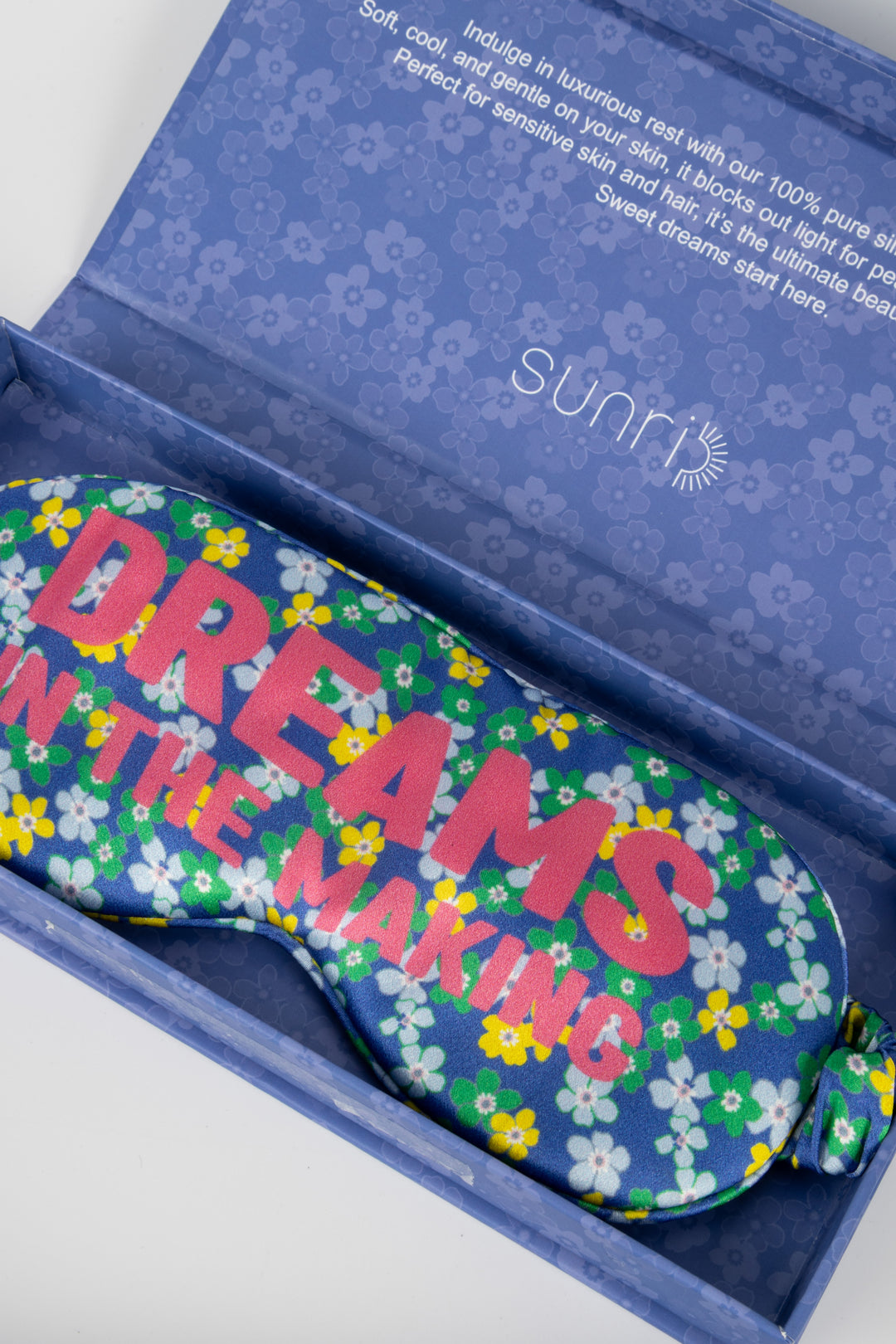 Floral eye mask with 'Dreams in the Making' text in a branded box
