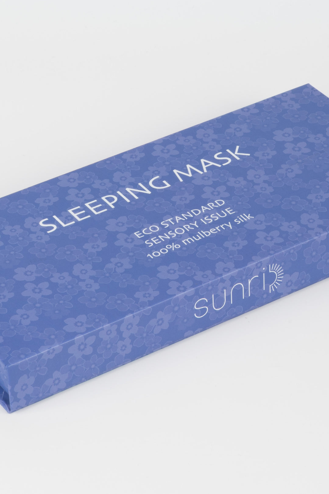 Blue packaging of a sleeping mask with text on a white background