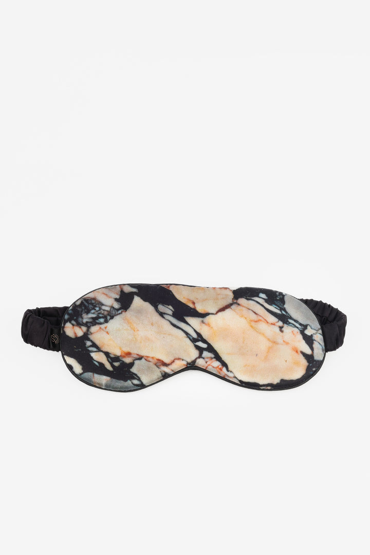 Marble-patterned sleep mask on a white background