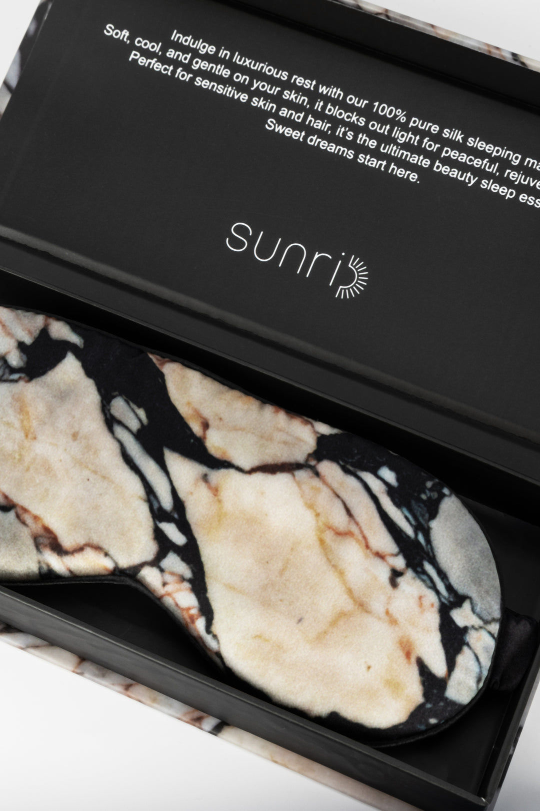 Marble-patterned eye masks in a black box with 'sunri' branding.