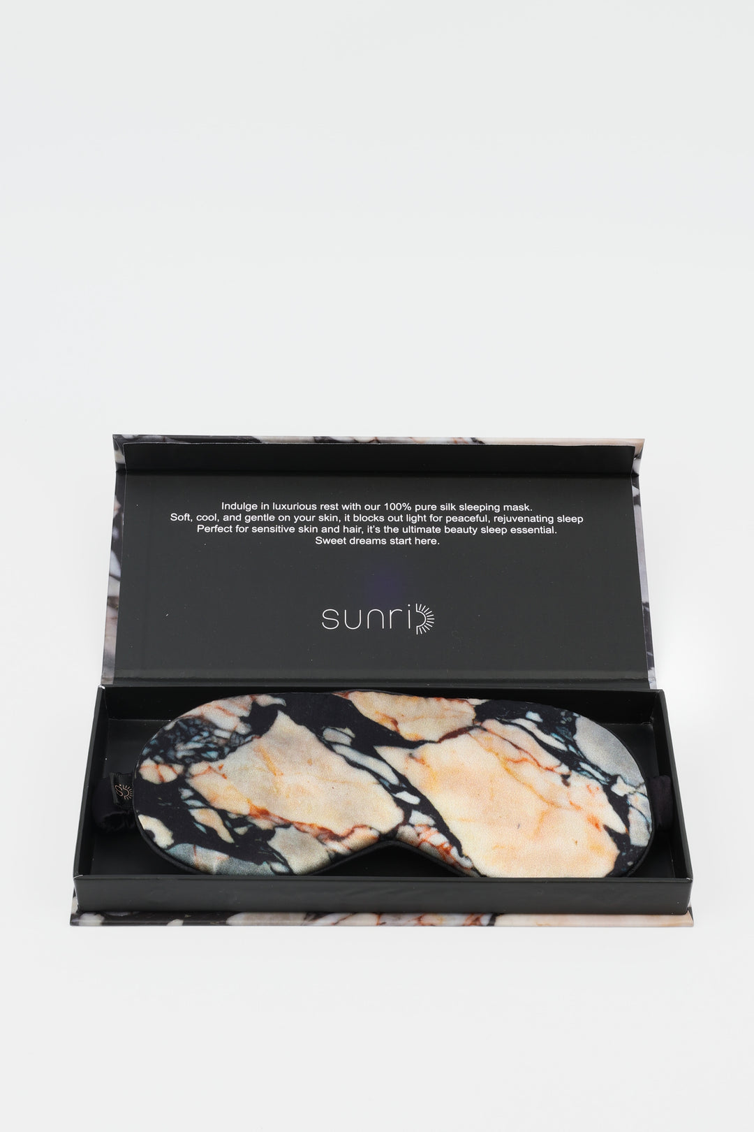 Marble-patterned eye masks in a black box with 'sunri' branding on a white background