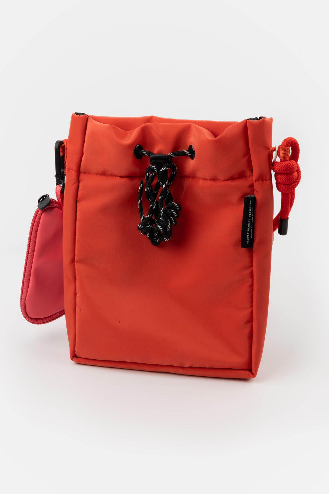 Red bag with a black chain on a white background