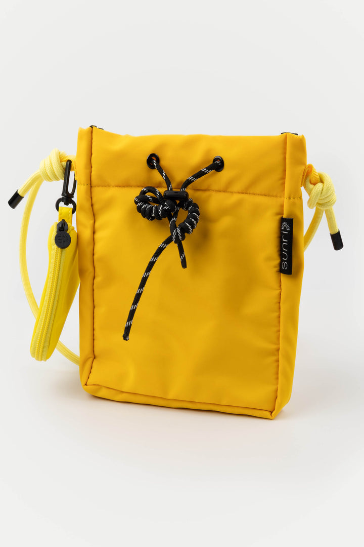 Yellow drawstring pouch with black drawstrings on a white background