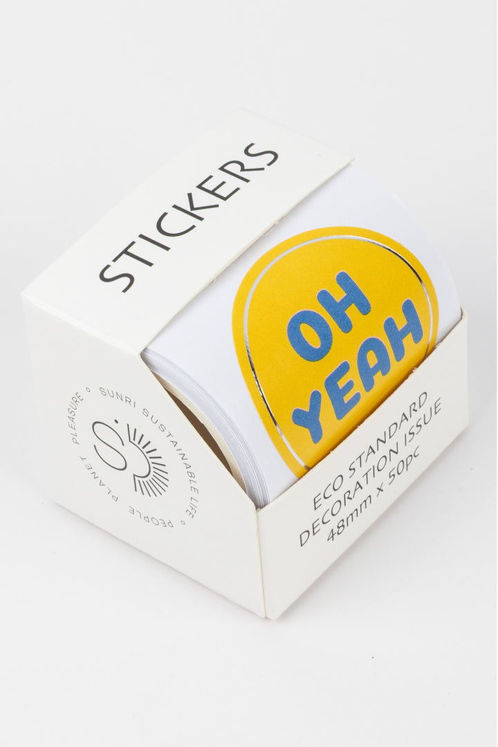 Pack of stickers with a yellow heart-shaped sticker saying 'OH YEAH' on a white background