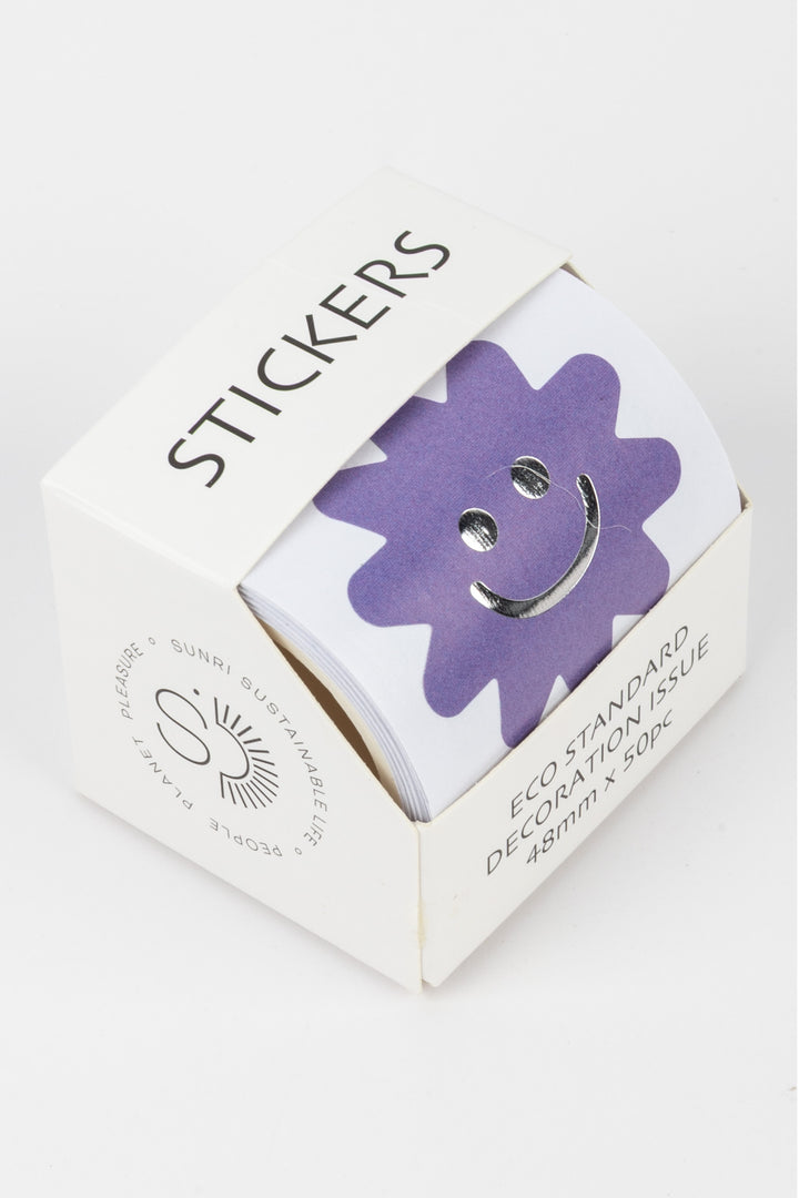Box of stickers with a purple flower design on a white background