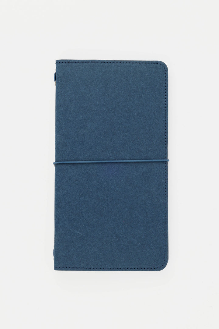 Blue travel sketch journal on a white background