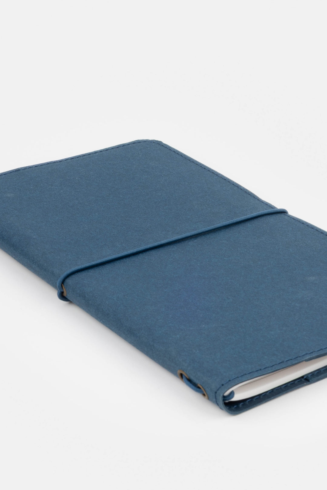 Blue sketch journal with a strap on a white background
