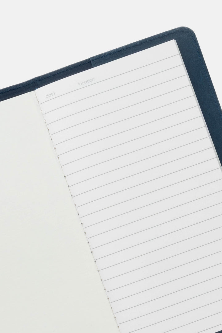 Notebook with lined pages on a white background