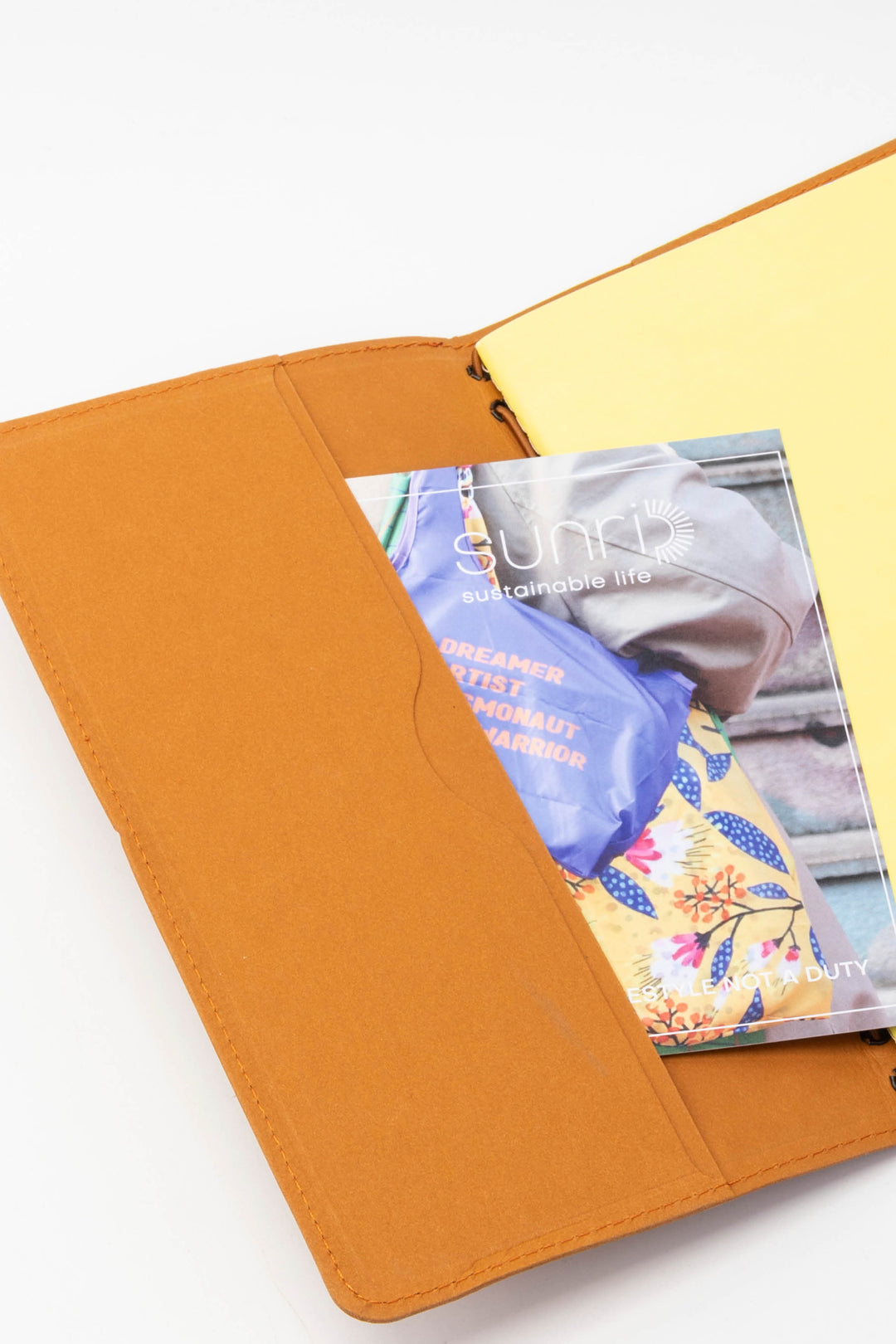 interior of orange sketch journal showing compartment for cards 