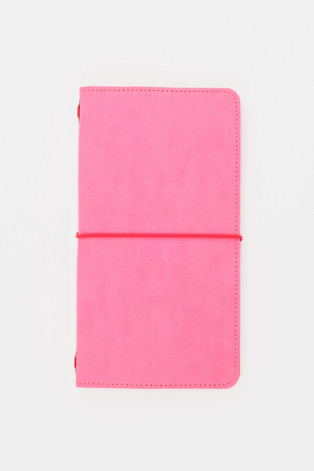 Pink sketch journal with a elastic band on a white background