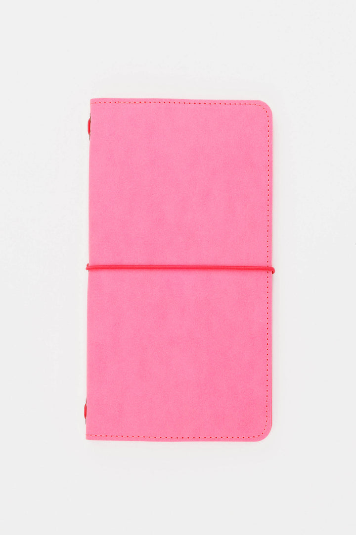 Pink sketch journal with a elastic band on a white background