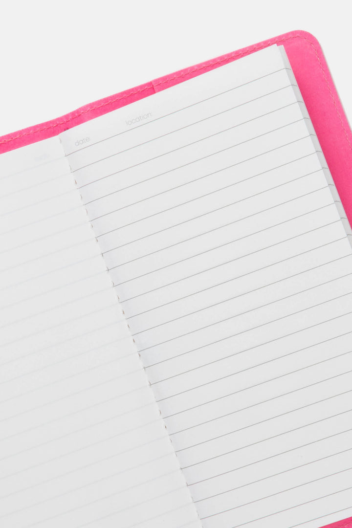 Open pink sketch journal showing ruled and blank pages